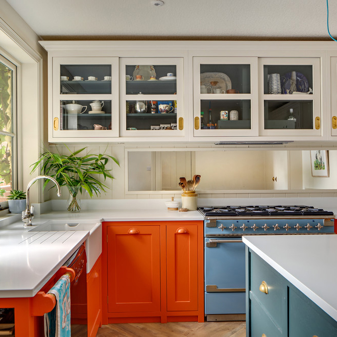 view of kitchen with cupboards and white work surface