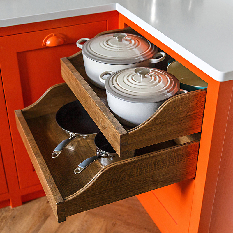 view of cooking pots and wooden drawers